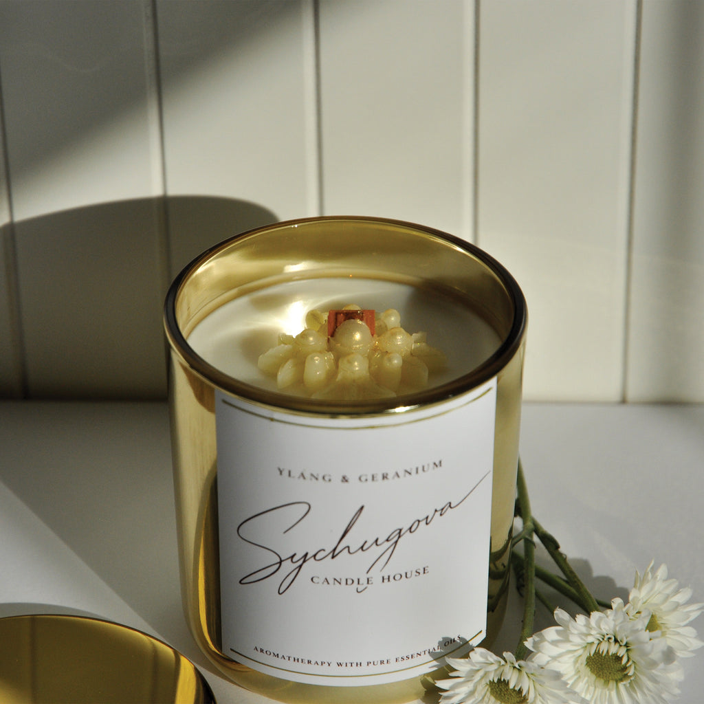 Floral coconut-soy candle with ylang ylang, rose, geranium, and copaiba balsam essential oils for stress relief