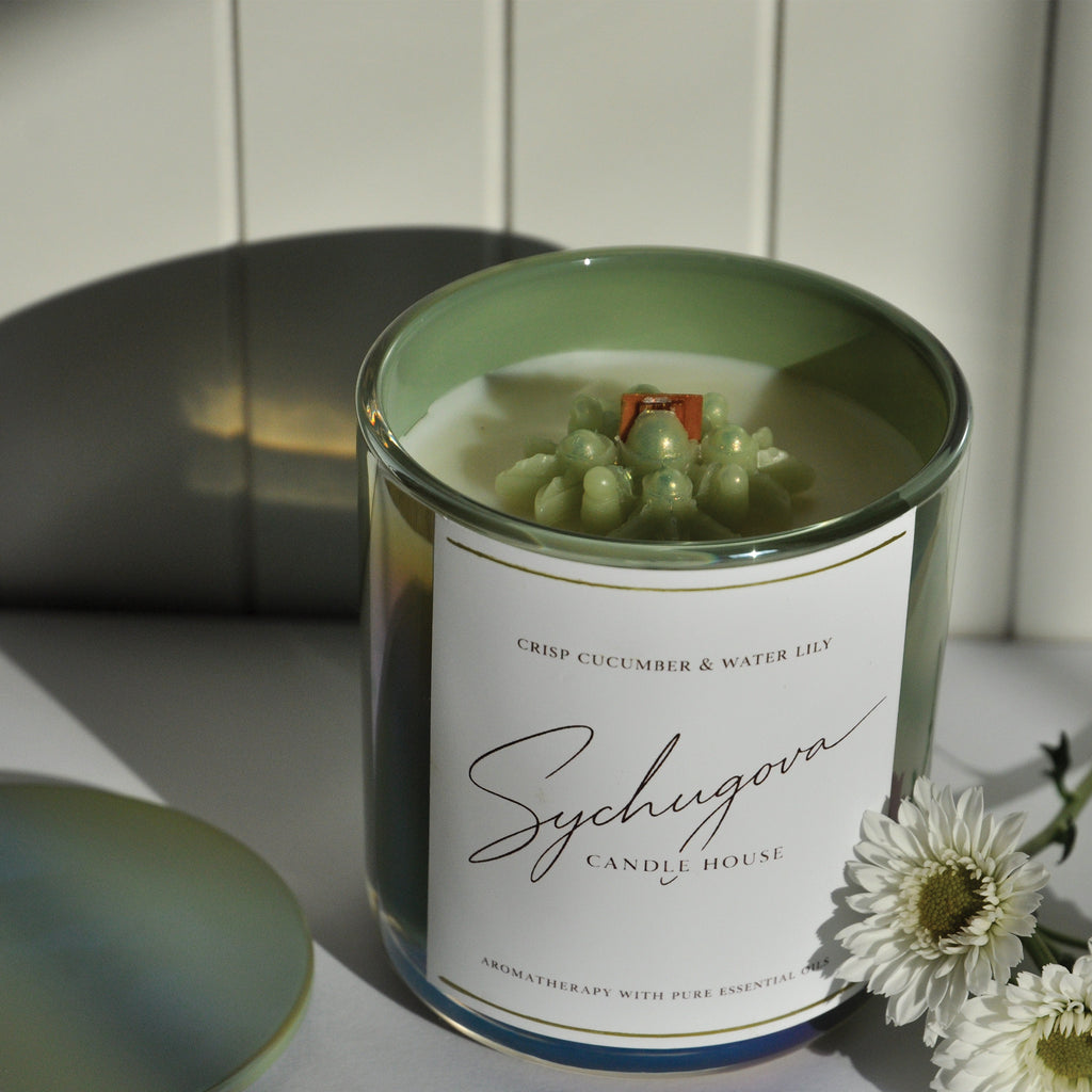 Cucumber and waterlily candle close-up showing coconut-soy wax and cherry wood wick texture